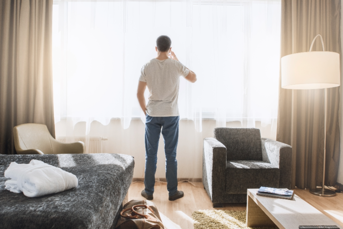 Man standing in hotel room